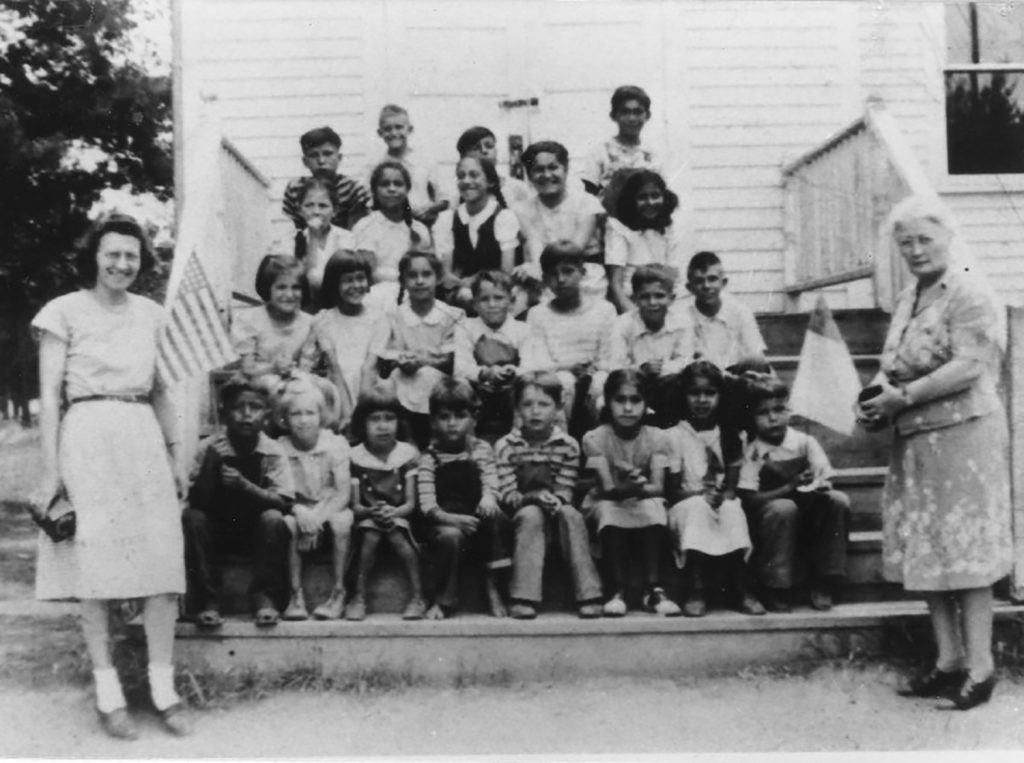 A photo of a group of children in front of the Whitefish Church. Photo courtesy of Sylvia Bracklin-Baker.