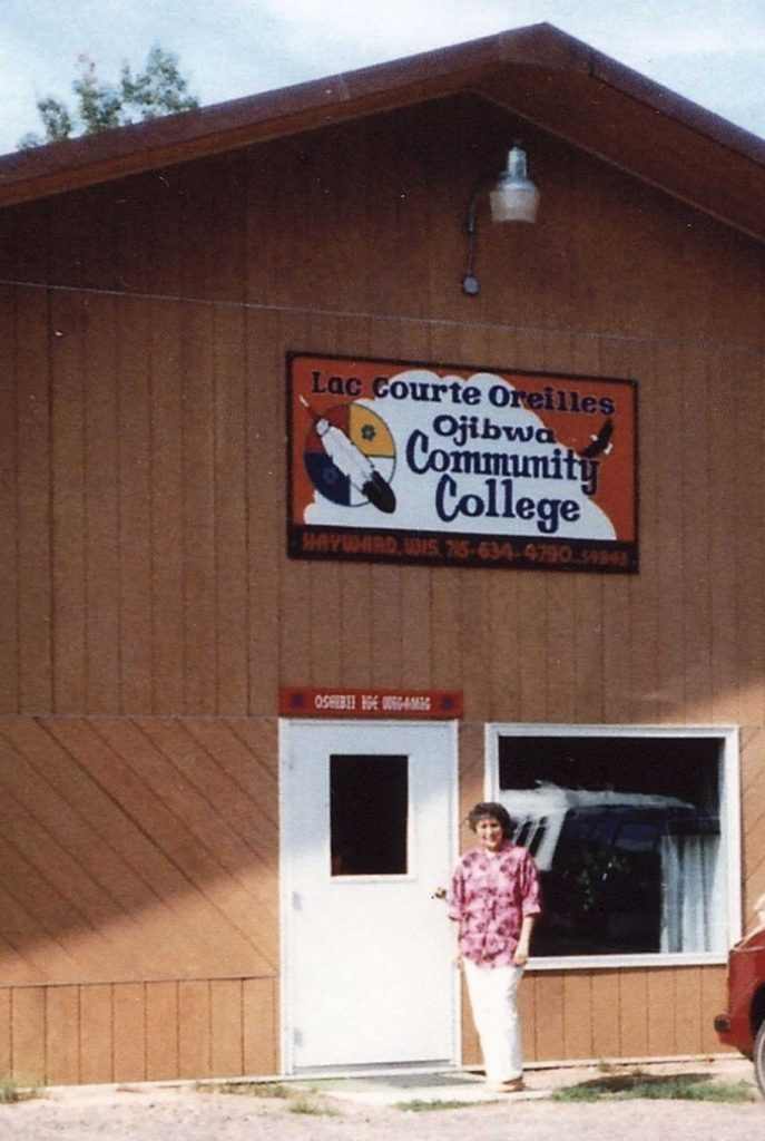 A photo of Sylvia Bracklin standing outside the first LCO College building as the Administrator of LCO College, around 1984. Photo provided by Sylvia Bracklin-Baker.